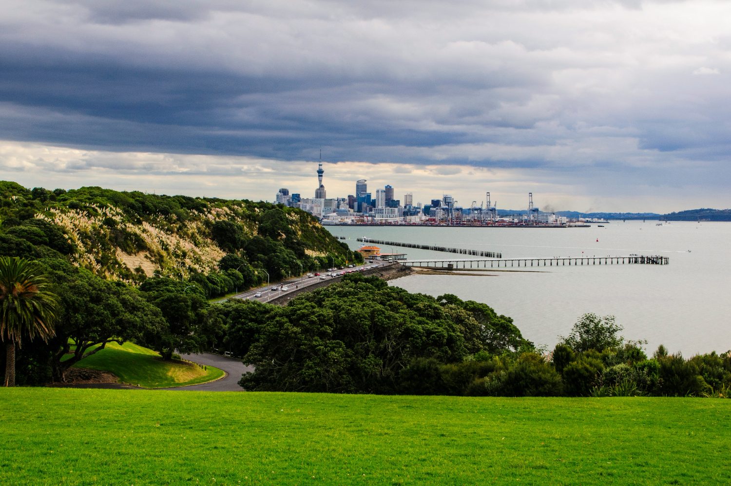 Auckland's skyline and the Waitematā Harbour seen across parkland from the Michael Joseph Savage Memorial