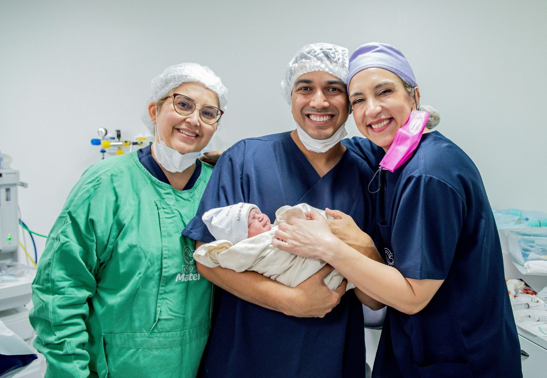A maternity team with a newborn shortly after birth