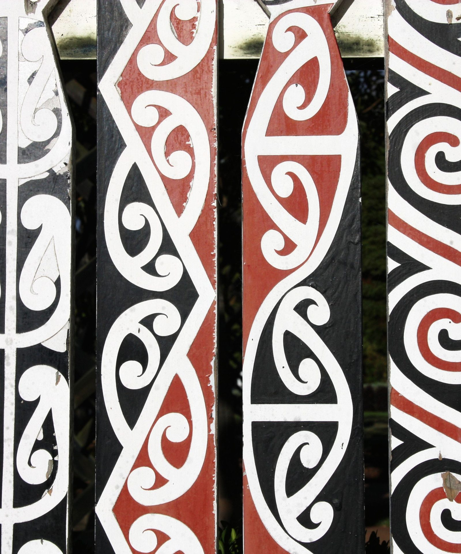 Carved and painted panels with red, black and white kōwhaiwhai patterns