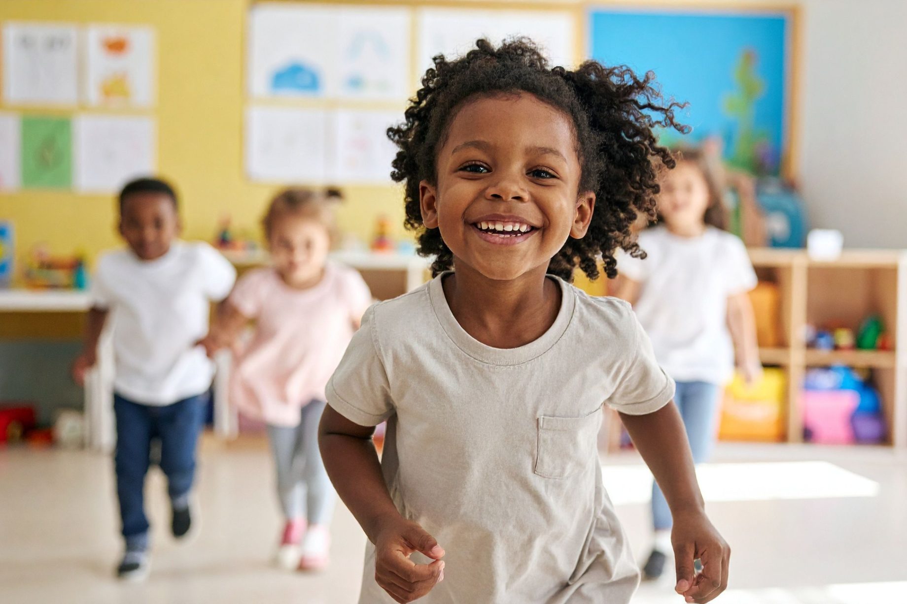 Young children playing in a bright early learning classroom
