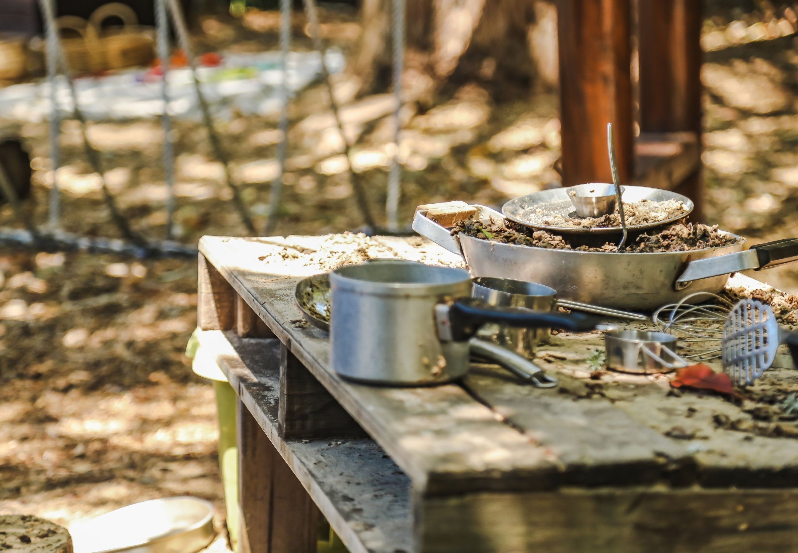 A mud kitchen in the outdoor play area of an early childhood centre