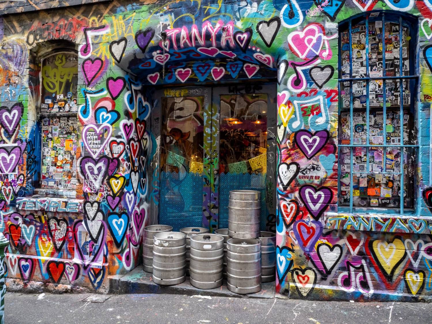 Layered street art covering both walls of Hosier Lane in central Melbourne