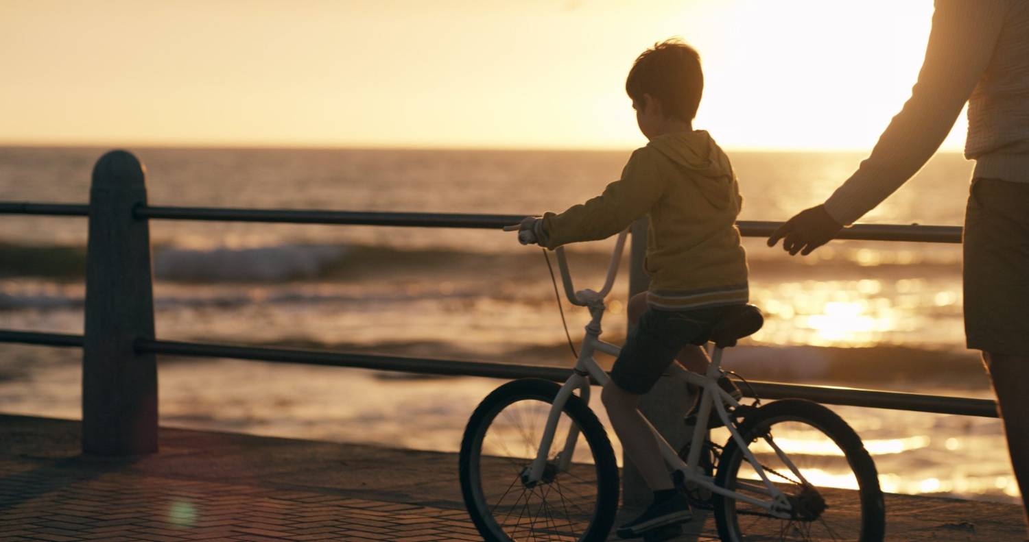 A family riding bikes on a trail