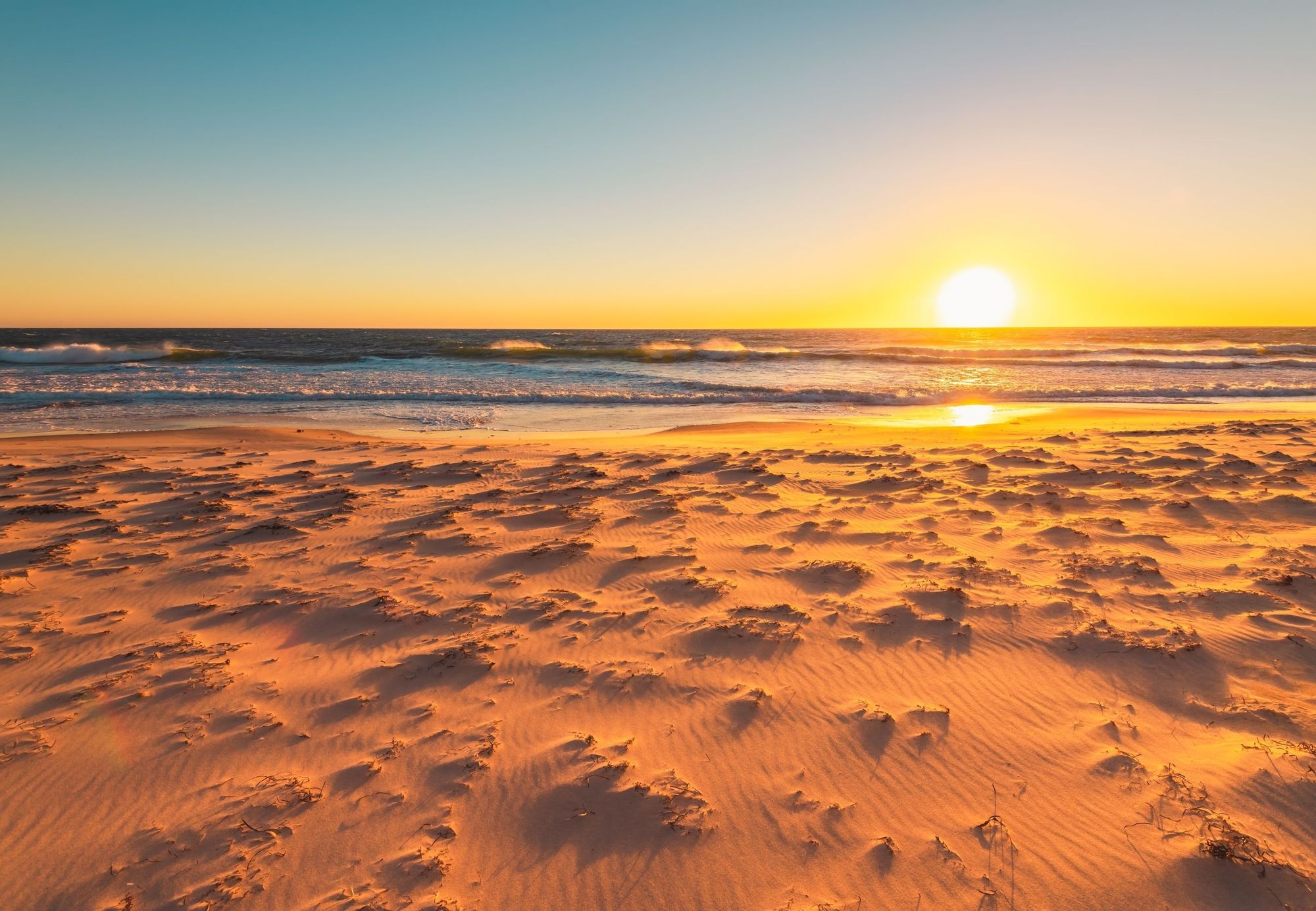 Sunset over the sand at Maslin Beach on the Fleurieu Peninsula