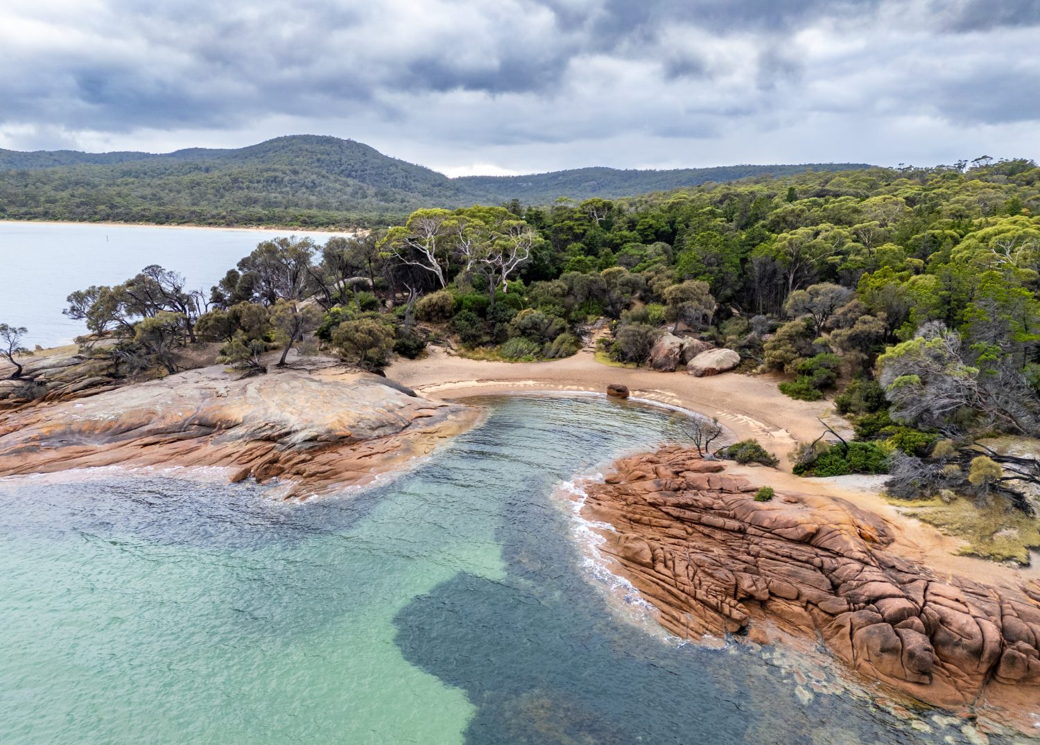 Clear water and granite boulders at Honeymoon Bay, Freycinet National Park