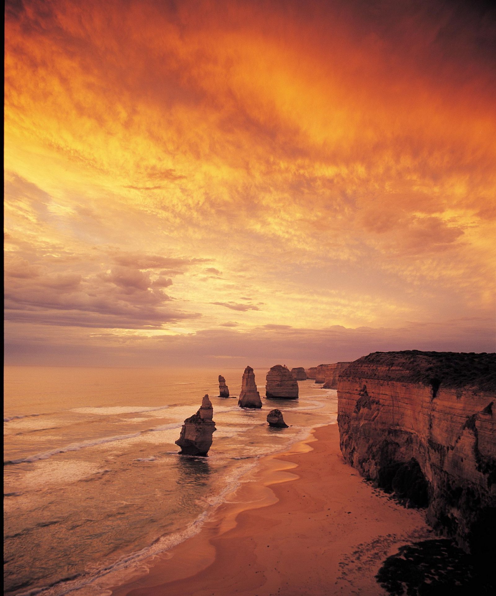 The Twelve Apostles limestone stacks at sunset on the Great Ocean Road