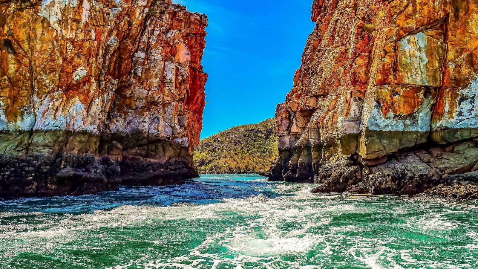 The Horizontal Falls pouring between red rock gaps in the Kimberley